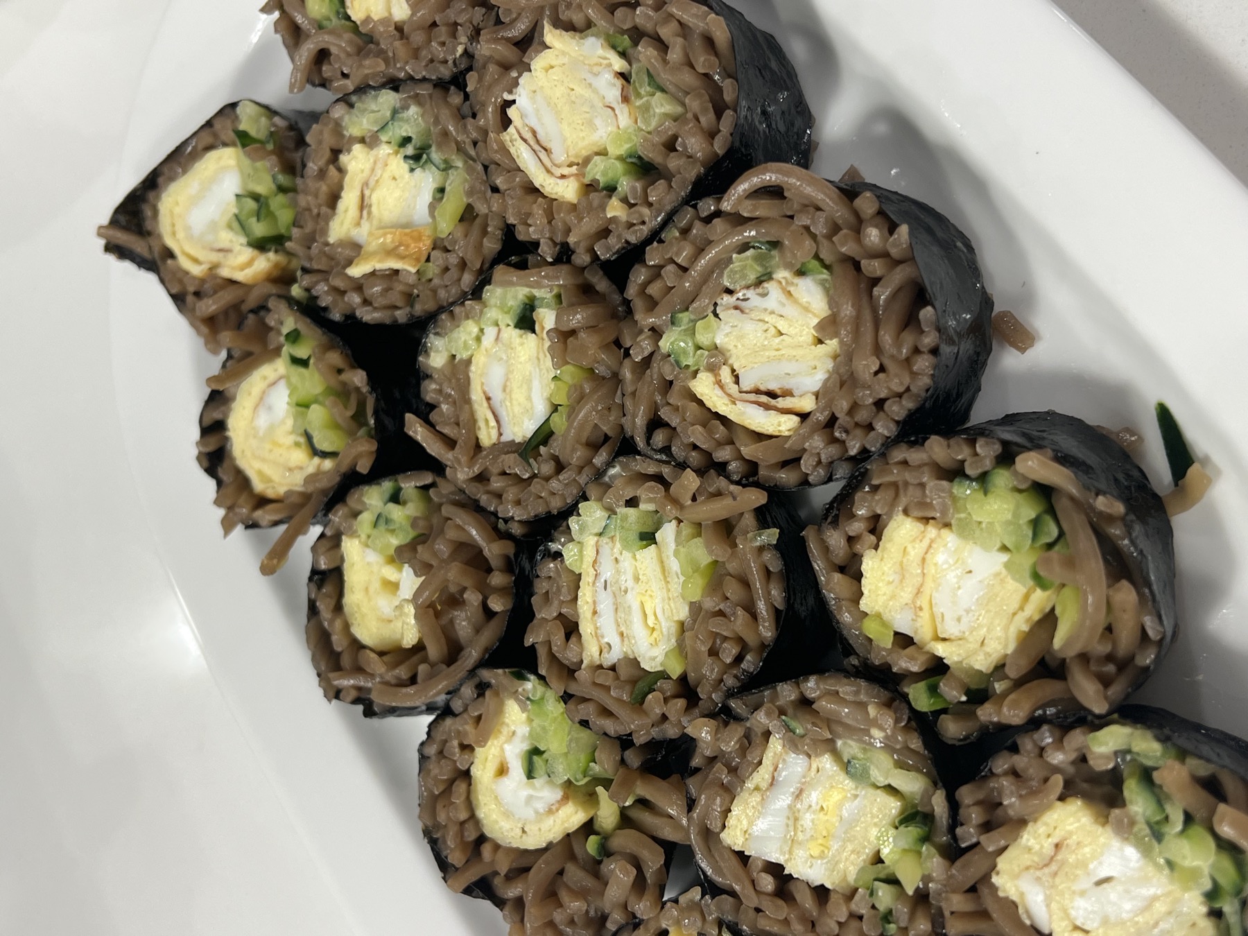 Kimbap rolled with buckwheat noodles, egg and cucumber